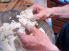 ...and then works it into the dry ingredients with his fingers